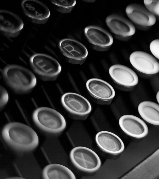 pexels-photo-938165-938165 Close-up shot of vintage typewriter keys in black and white, highlighting classic technology.